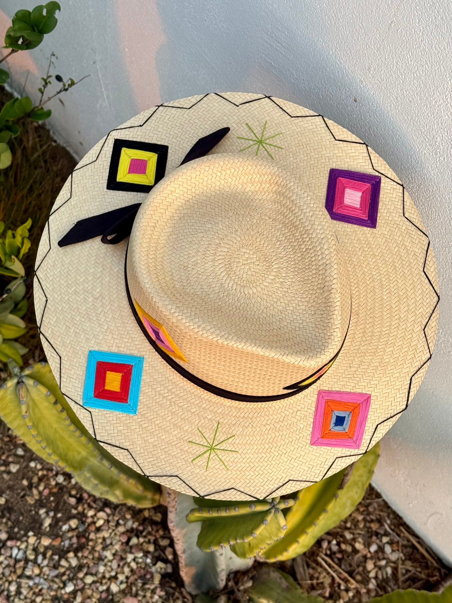 San Jose Sunhat with colorful patches and a black ribbon.